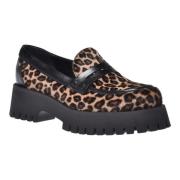 Loafers in leopard-print pony skin and black leather