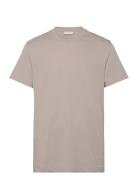 Logo Tape Tee Tops T-Kortærmet Skjorte Beige Calvin Klein Jeans